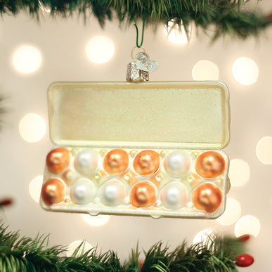 White egg carton shaped Christmas tree ornament with a natural wood texture.