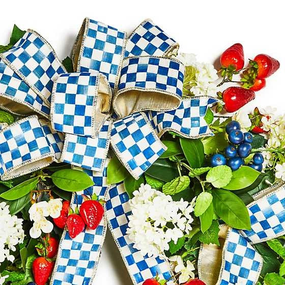 Royal Berry wreath with plastic strawberries and blueberries on a natural base trimmed with wired ribbon.