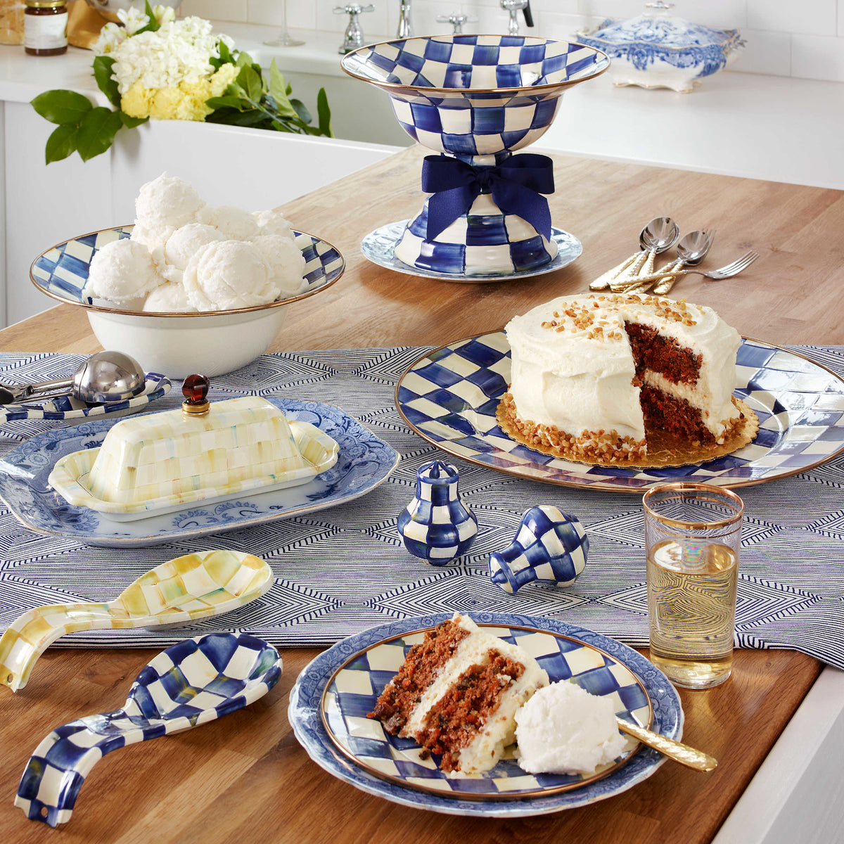 Round Royal Check serving platter with hand-painted blue checkered pattern on steel base and bronzed stainless rim.