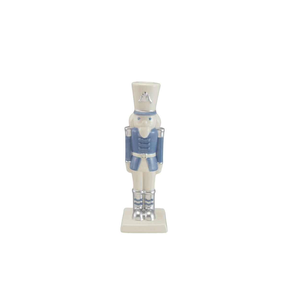 Ceramic nutcracker taper candle holder in white and blue with silver electroplated accents.