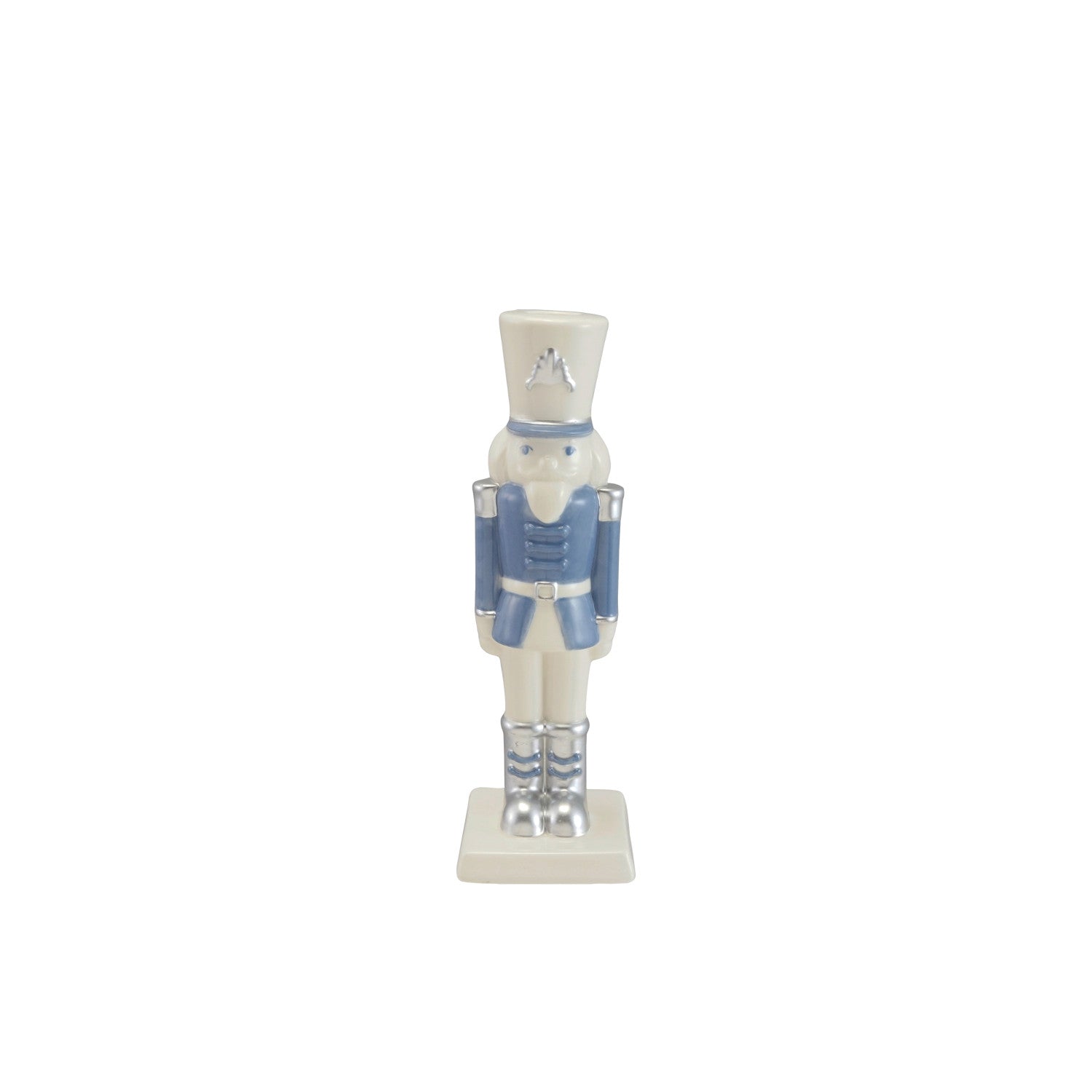 Ceramic nutcracker taper candle holder in white and blue with silver electroplated accents.