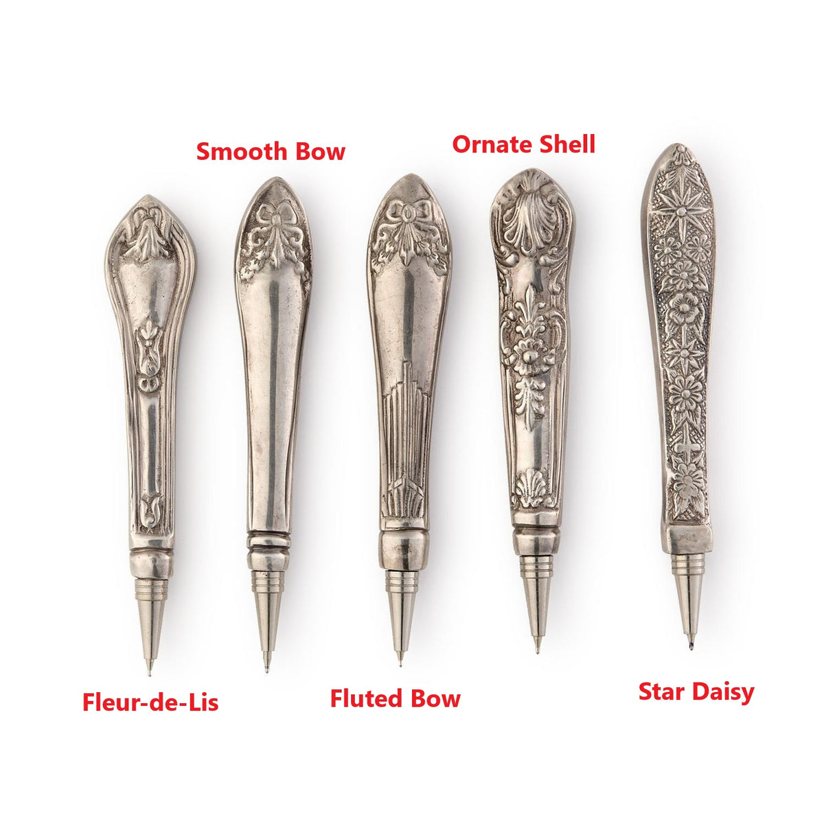 Five Victorian silver-plated knife handle pens in Fleur-de-Lis, Bow, Shell, and Star Daisy designs.
