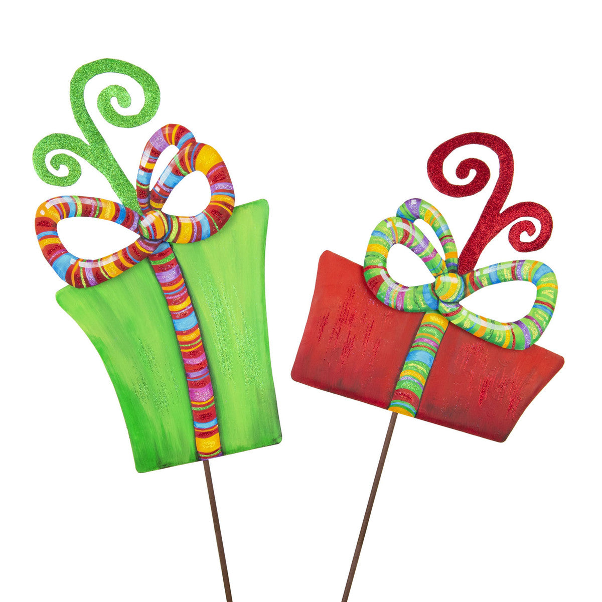 Two decorative gift box stakes, one green and one red, with colorful striped bows and glittery swirls.