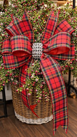 Large red plaid holiday bow with a sparkling rhinestone center knot on a green berry plant.