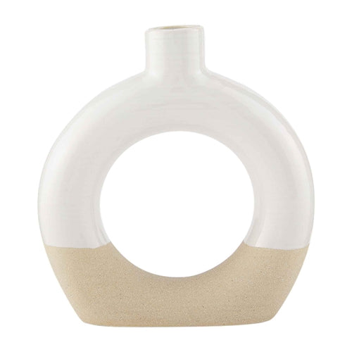 Stoneware cutout vase with a geometric silhouette in earthy tones.