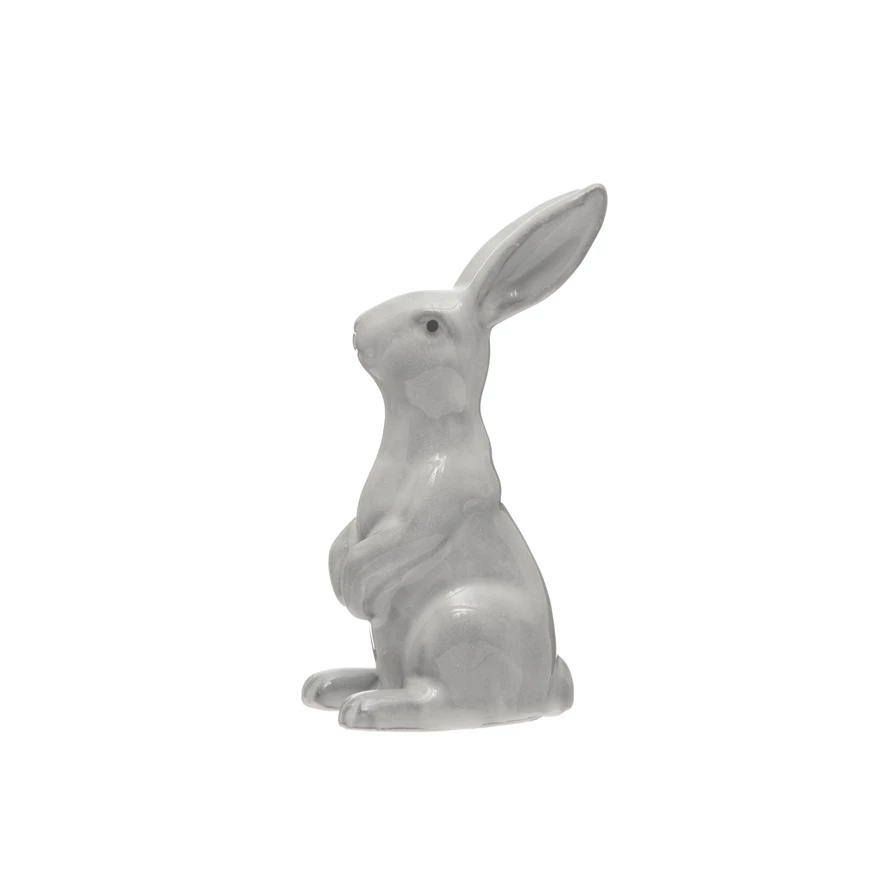White stoneware rabbit figurine with reactive glaze finish