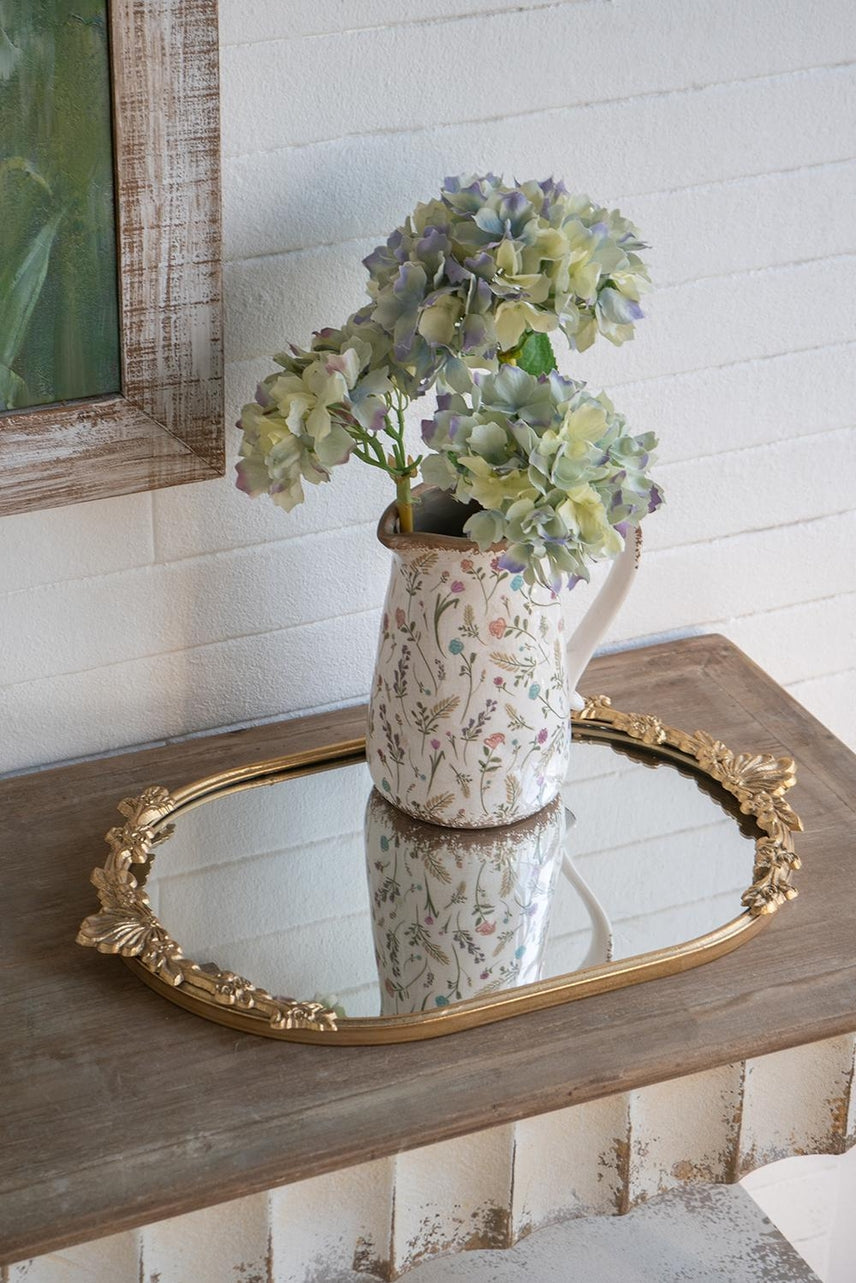 Gold iron frame mirror tray with intricate floral cutout pattern