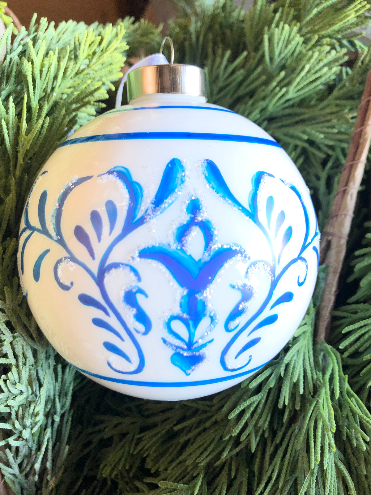 Blue scroll-patterned ball with white accents