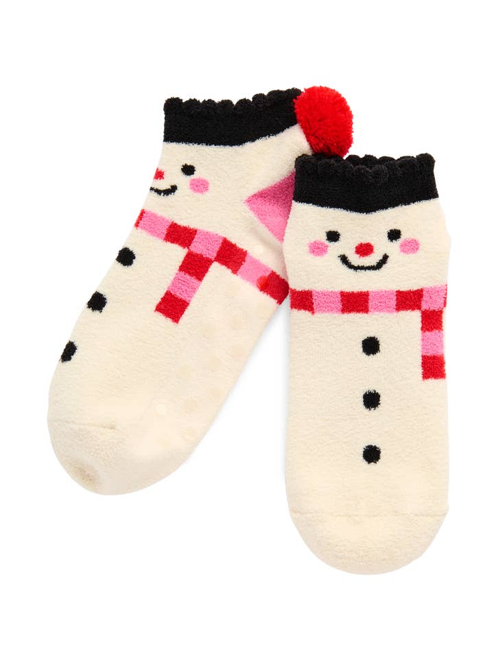 A pair of ivory fuzzy snowman socks with pink scarves, black hats, and a red pom-pom.
