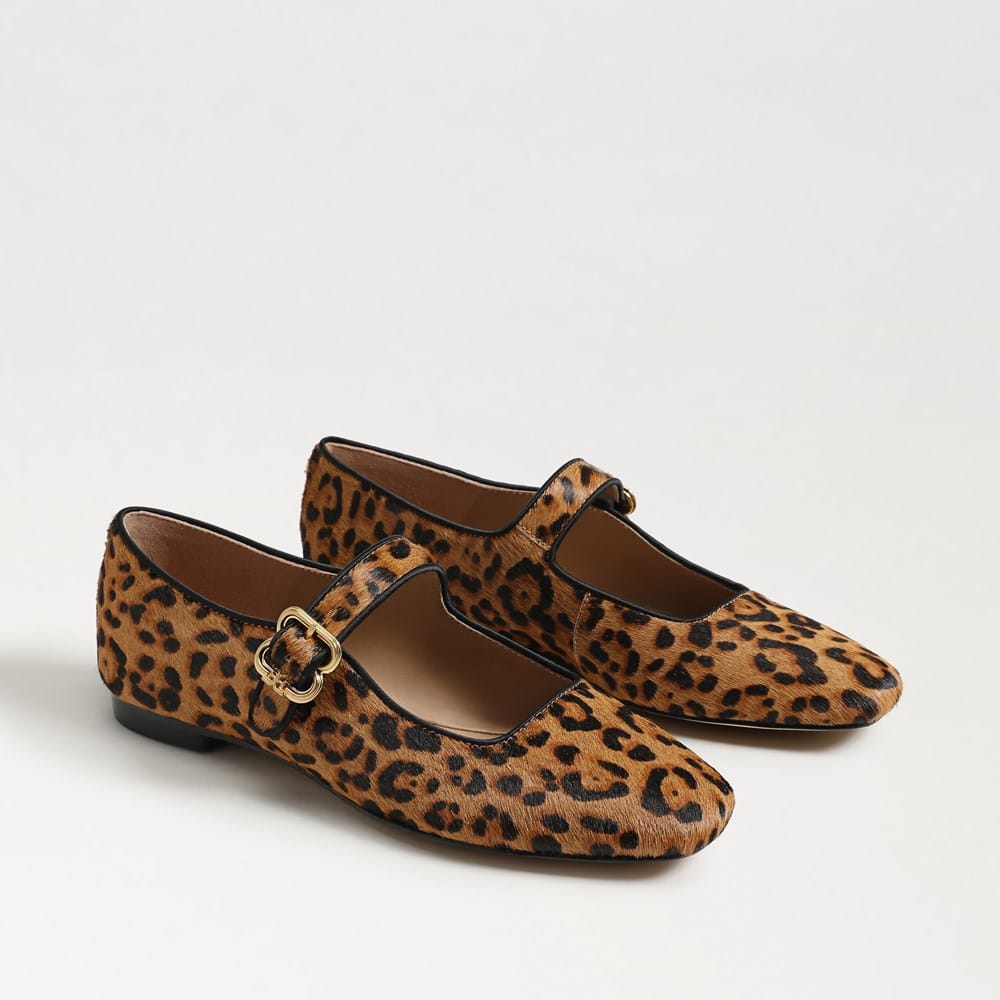Michaela Mary Jane flats in leopard print calf hair with a gold buckle strap and pointed toe.