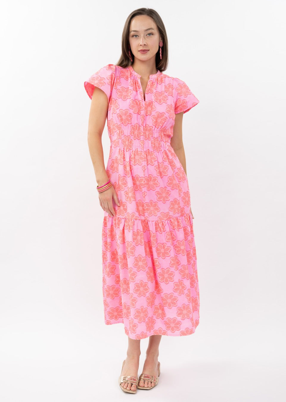 Theresa Clip Daisy Dress in light fabric featuring smocked waist, flutter sleeves, and allover daisy print.