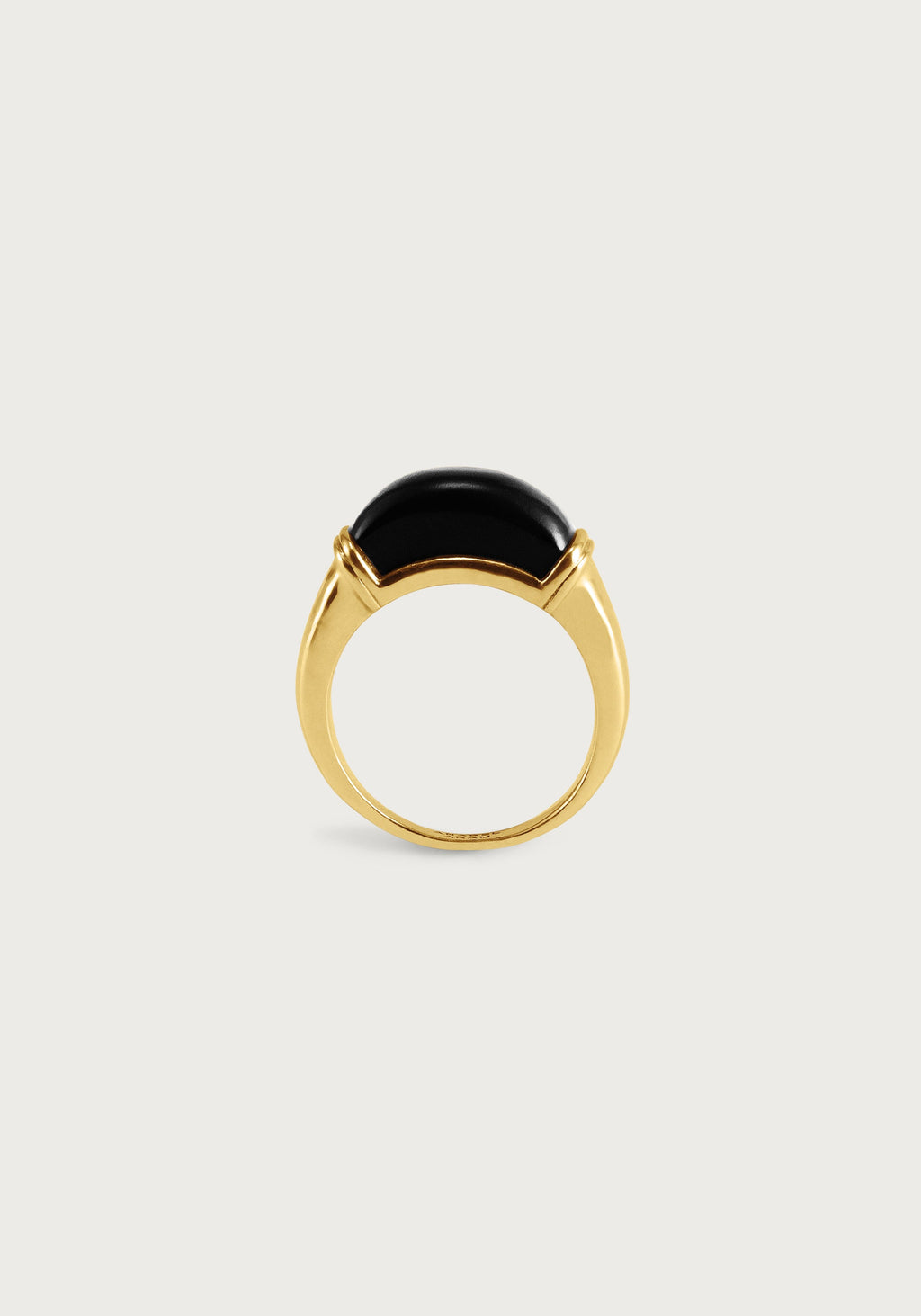 Forza Ring featuring a curved 18K gold plated brass band set with a polished black onyx stone.