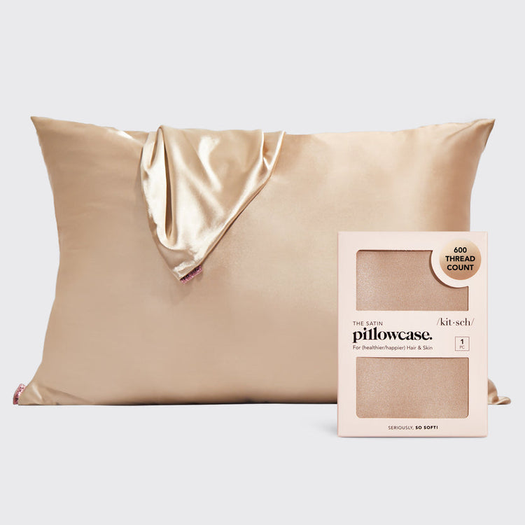 Satin pillowcase in a soft neutral tone with smooth texture.