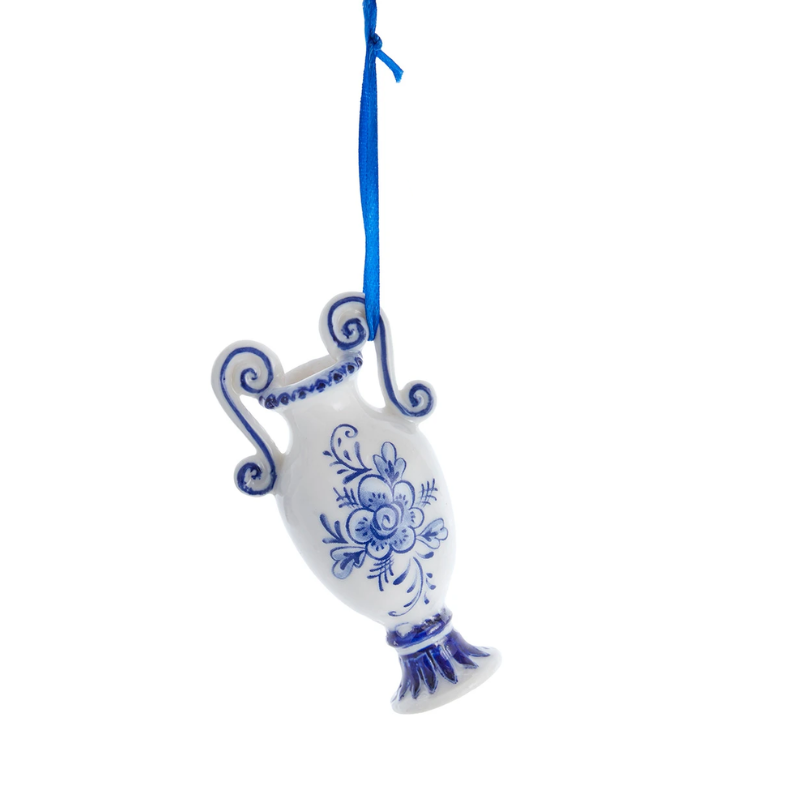 Miniature blue and white ceramic vase ornament with floral design hanging from a blue ribbon.