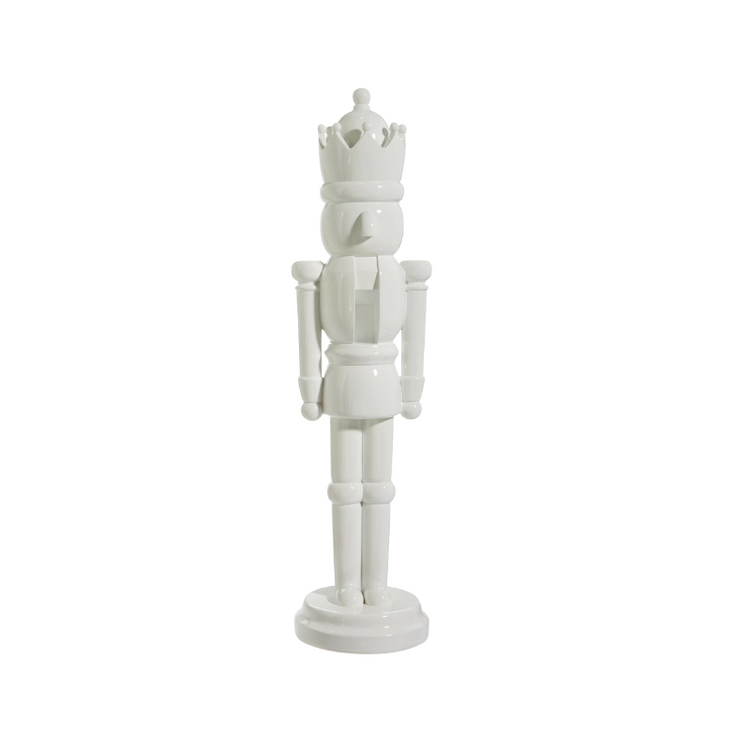22.5-inch tall decorative white resin nutcracker with a glossy finish and crown.