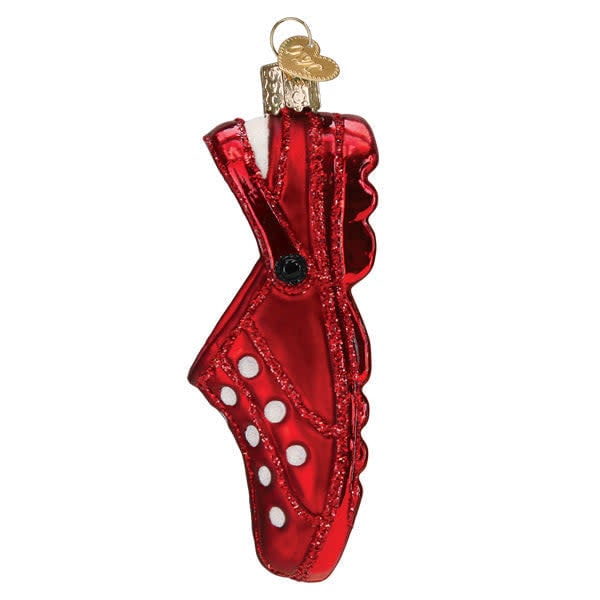 Side view of a small red rubber clog ornament with classic wavy sole silhouette.
