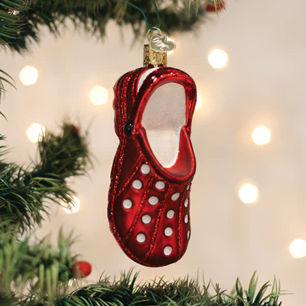 Red rubber clog ornament with classic silhouette and glossy finish.