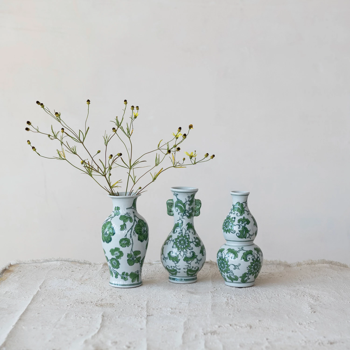 Hand-painted stoneware vase with floral design in earthy tones