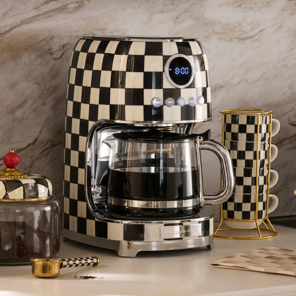 Courtly Check Drip Coffee Maker with a glass carafe on a kitchen counter with matching accessories.