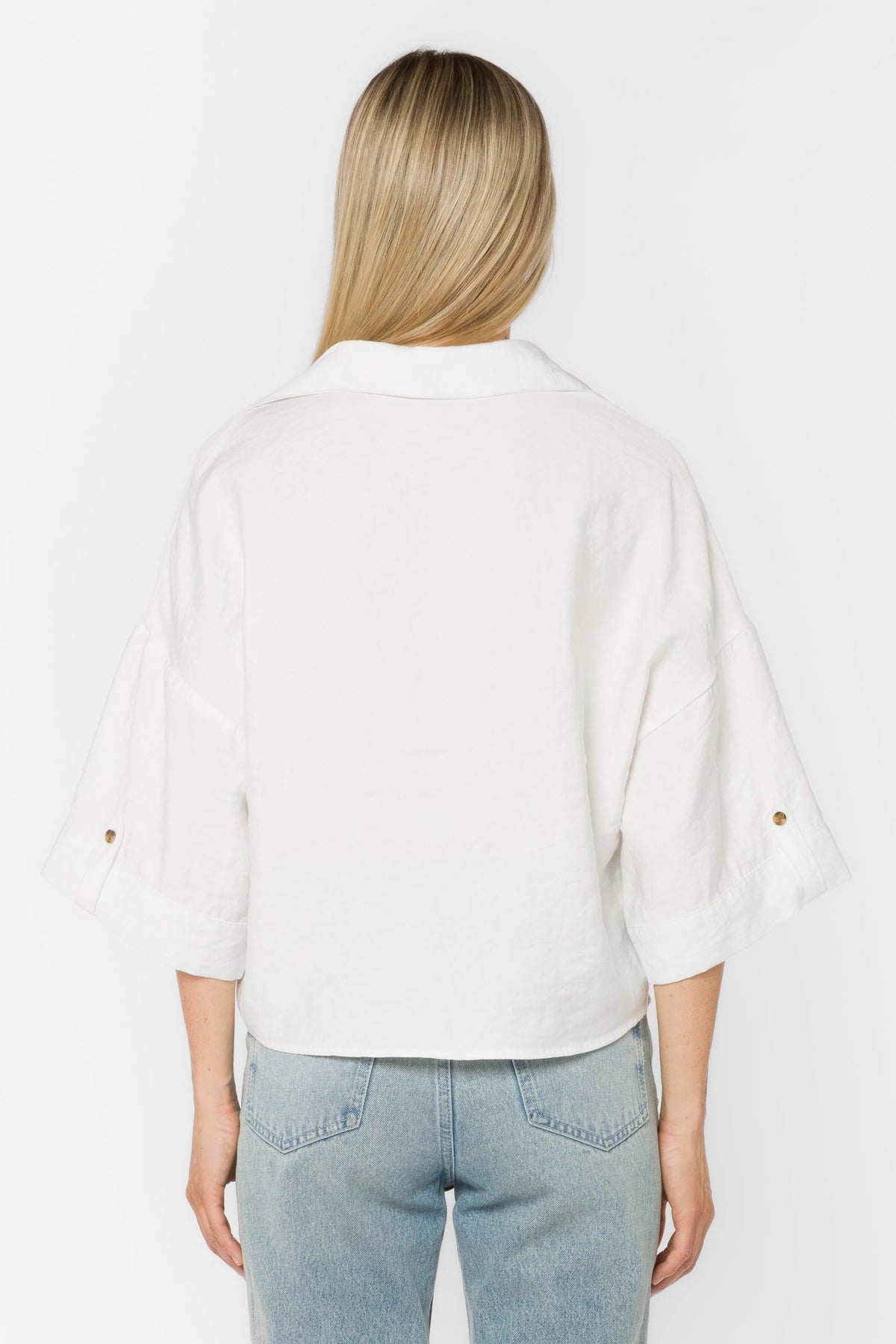 Minx Shirt in black viscose blend with collar, button front closure, elbow sleeves, and high-low hem.