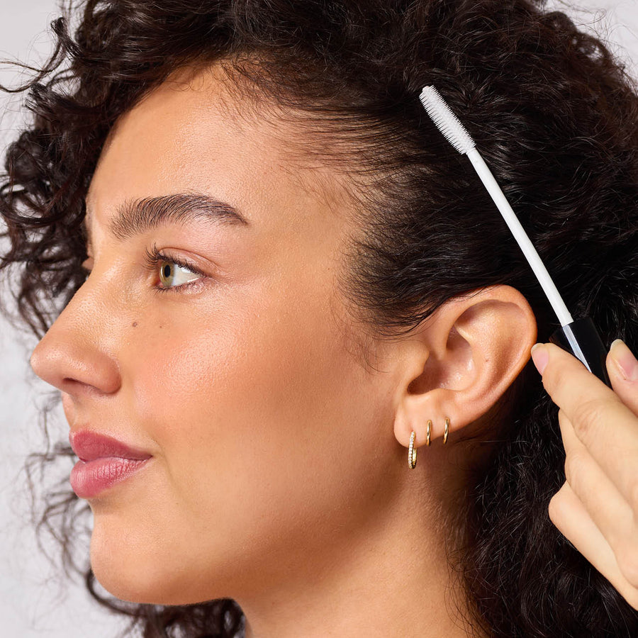 Clear gel styling wand in compact tube with black cap
