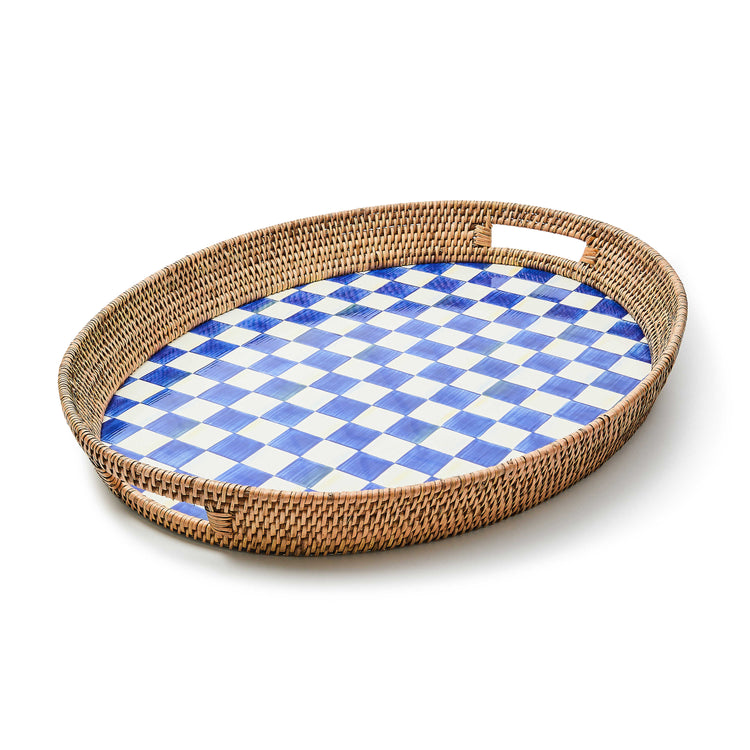 Oval party tray with a blue and white checkered enamel base and a woven rattan rim with handles.