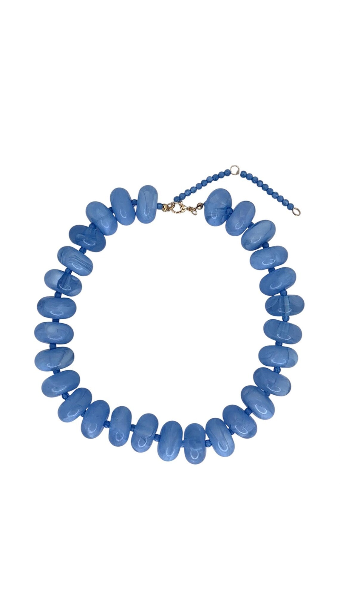 Candy Necklace featuring oversized, glossy blue marbled beads with an adjustable gold-tone clasp.