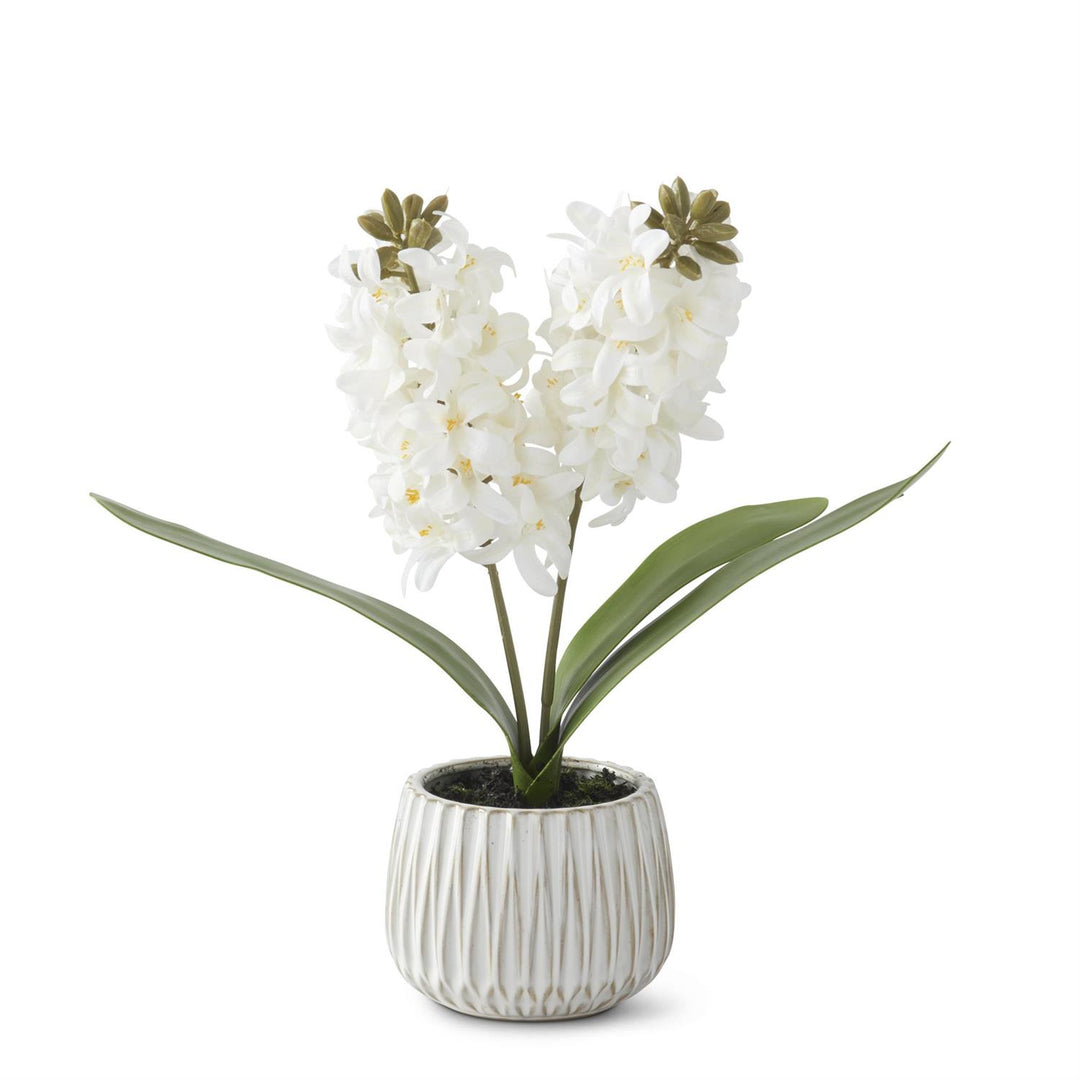 White ceramic pot holding a realistic white hyacinth plant with faux dirt in a 16-inch tall arrangement.