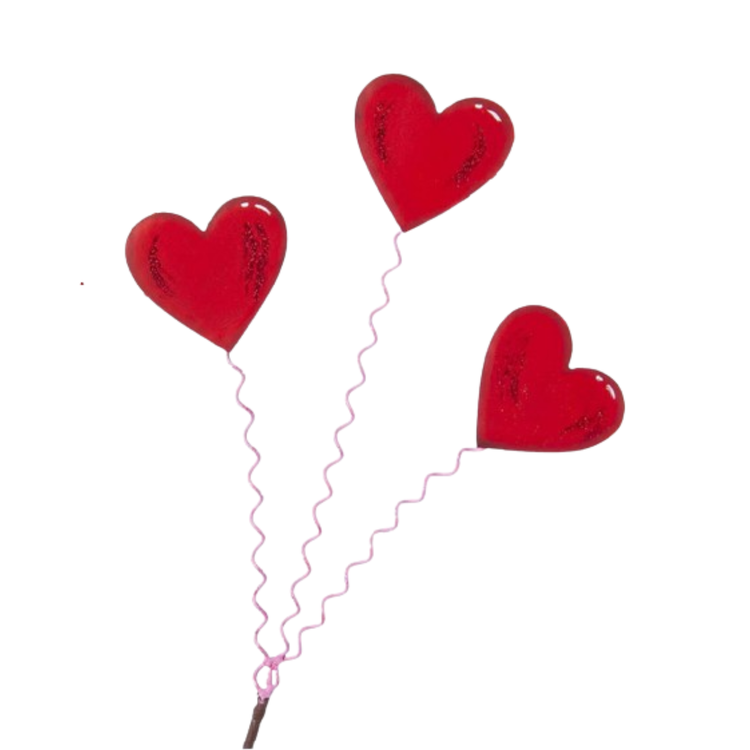 Three heart-shaped metal stakes with a matte finish designed as garden markers.