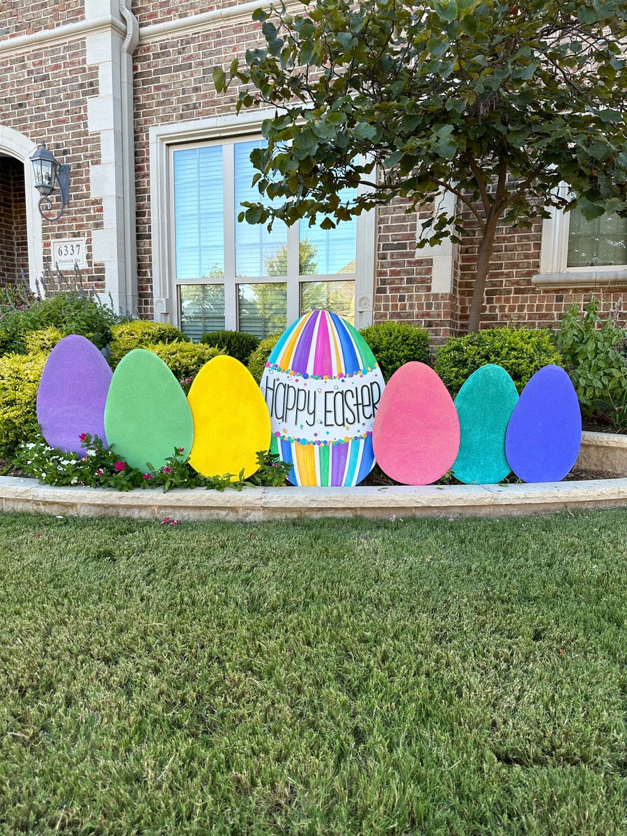 Three-dimensional glitter egg stake with a natural wood finish.