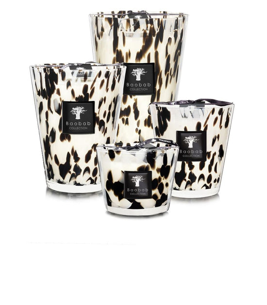 Black Pearls candle with a black wax surface featuring embedded pearl-like accents.