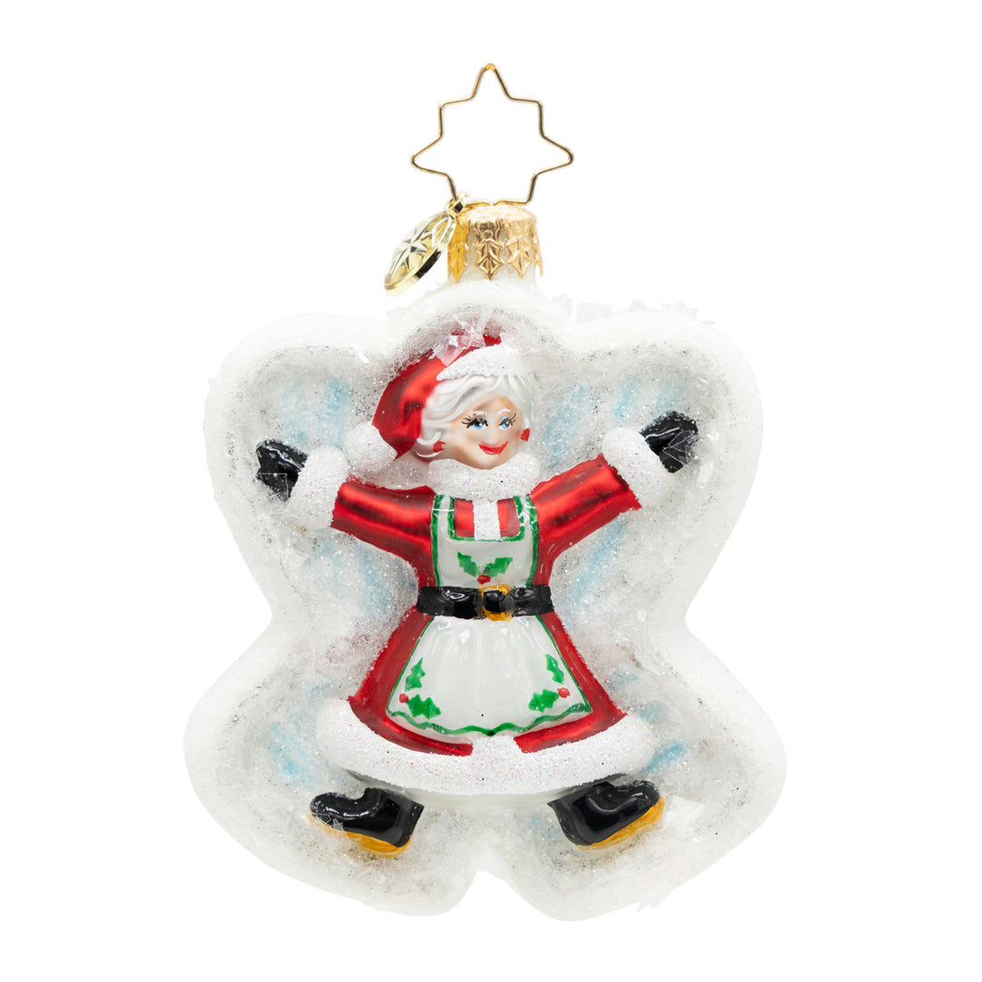 Snow Angel Duo Gem glass ornament featuring Mrs. Claus making a snow angel in a white glitter frame.
