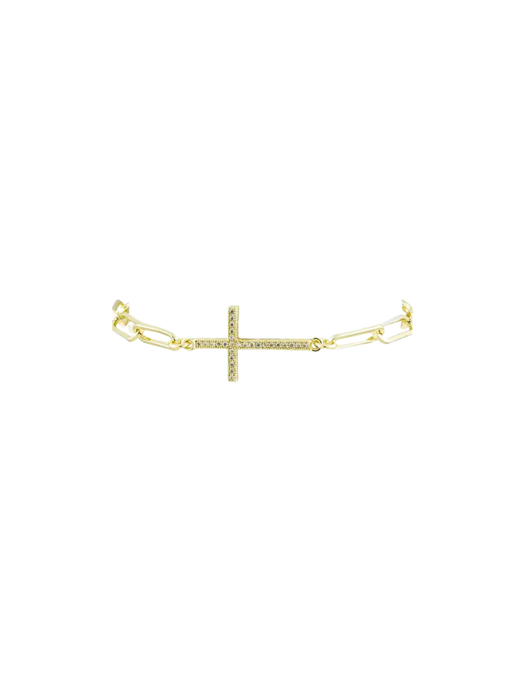 Gold paperclip link bracelet featuring a horizontal cross charm set with small clear stones.