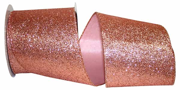4-inch wide rose gold glitter wired edge ribbon on a spool.
