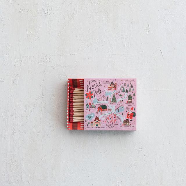 Matchbox safety matches featuring a North Pole scene with snow-covered trees on the cover.