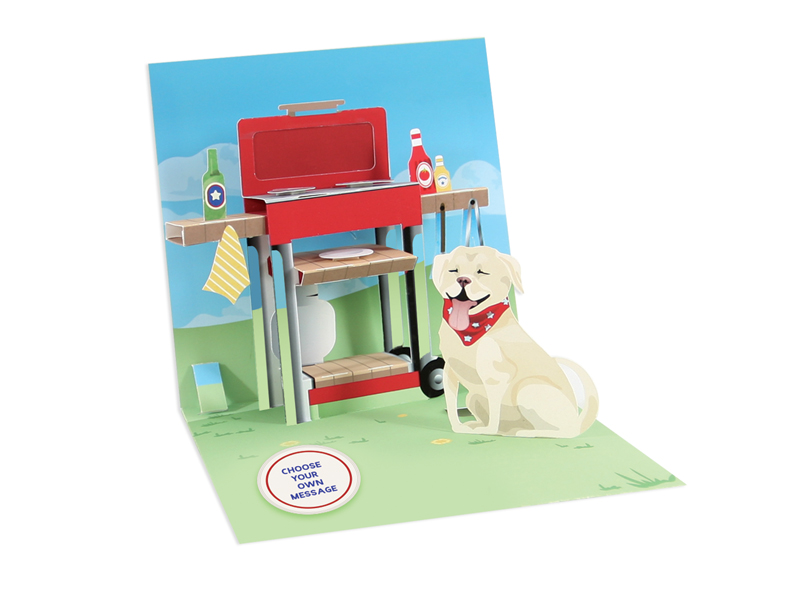 White envelope with silver foil text reading King of the Grill on a Happy Father's Day card.