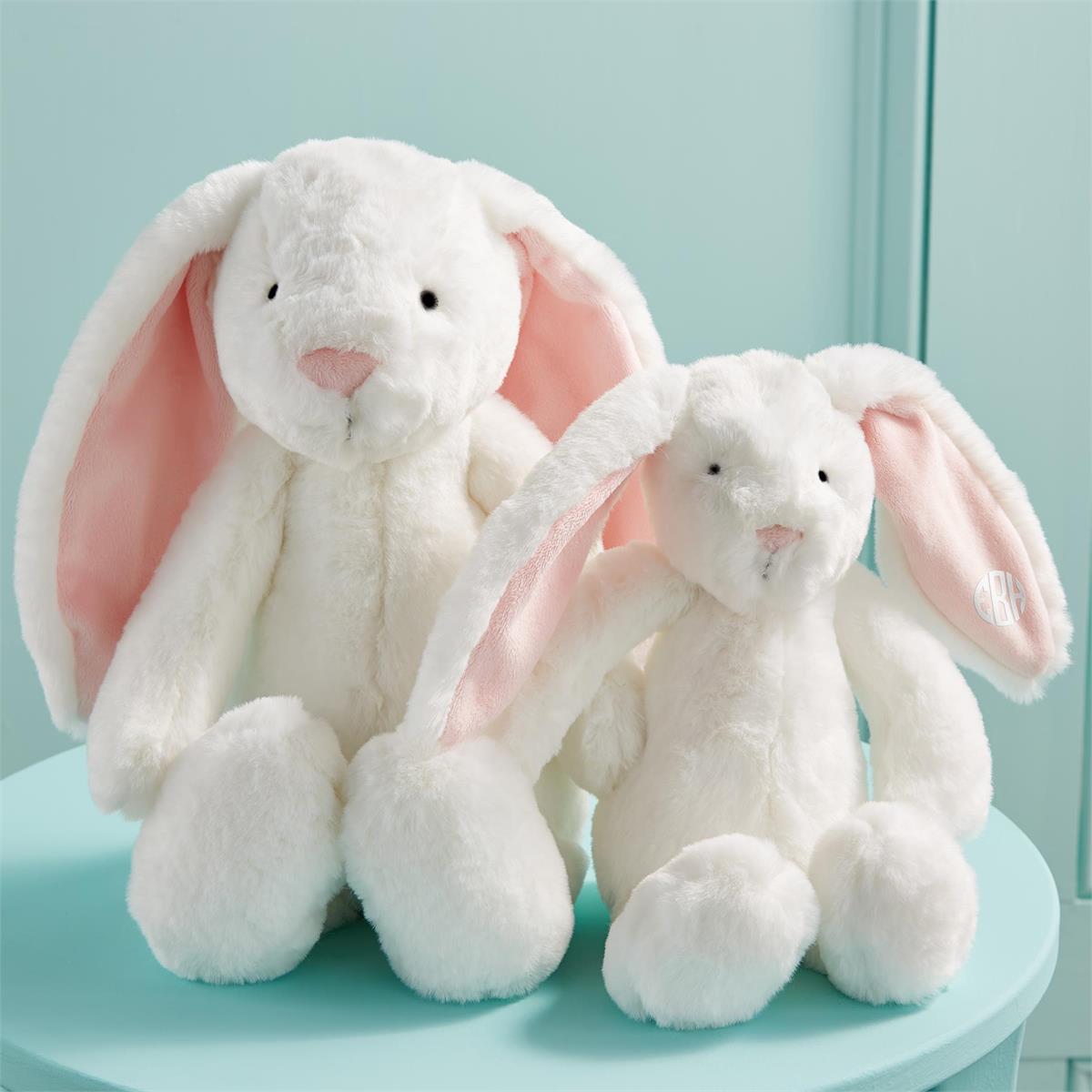 Plush bunny toy made of polyester fabric with a soft rounded silhouette.