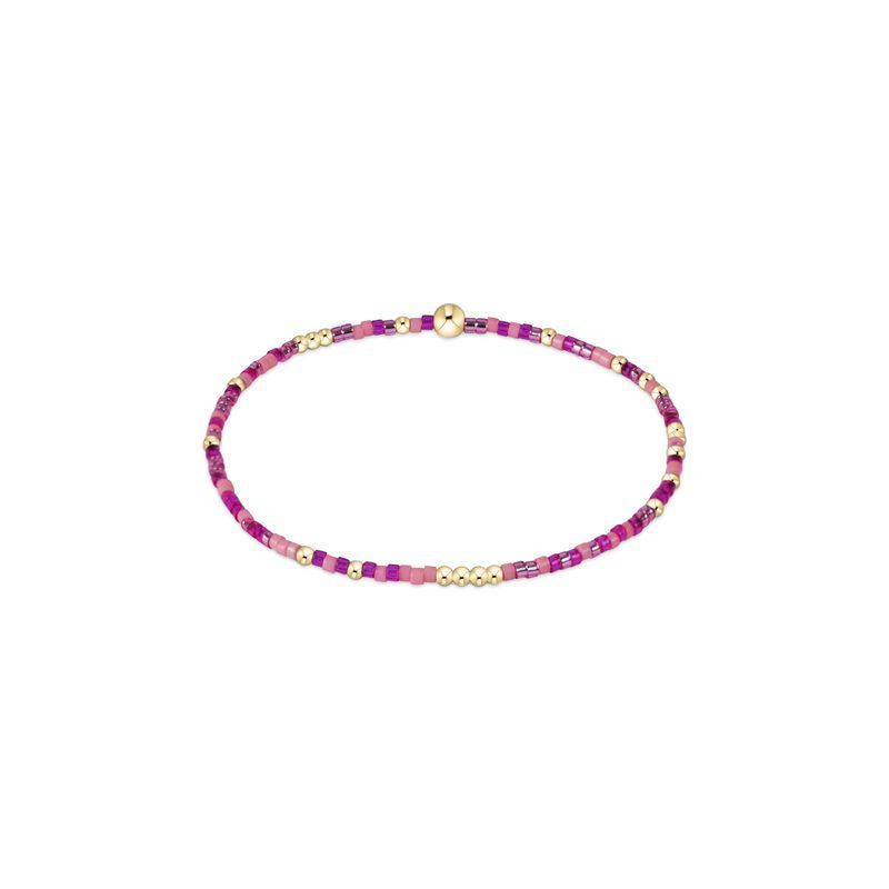Hand-beaded Hope Unwritten bracelet featuring mixed seed beads in various colors with gold accents on elastic cord.