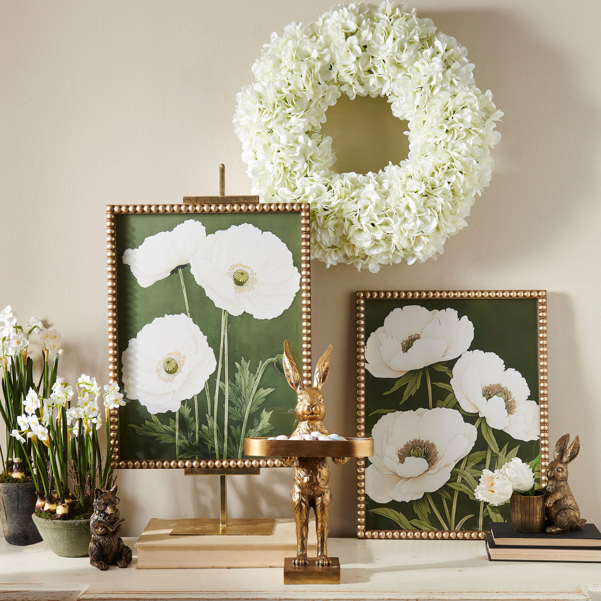 Framed wall art featuring a wood print with red poppy petals on an off-white background.