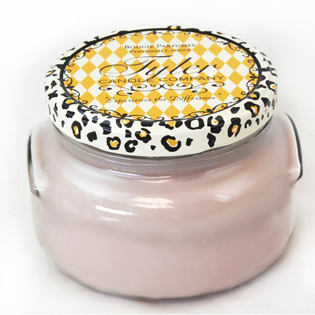 A 22oz Tyler Candle in a clear glass jar with an off-white wax and black wick.