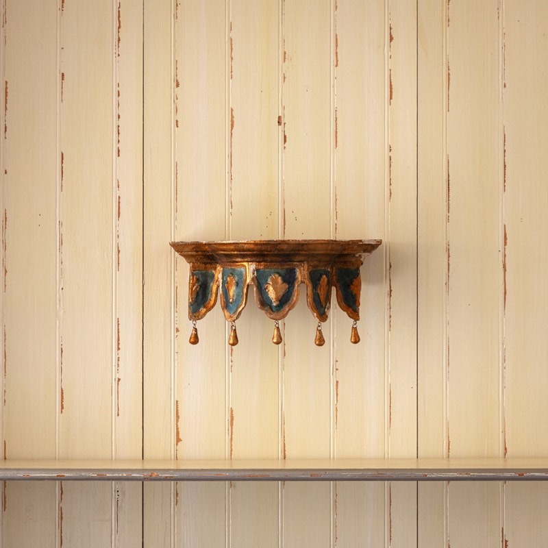 Chapelle Etagere wall shelf with gold and blue antique finish and hanging teardrop details.