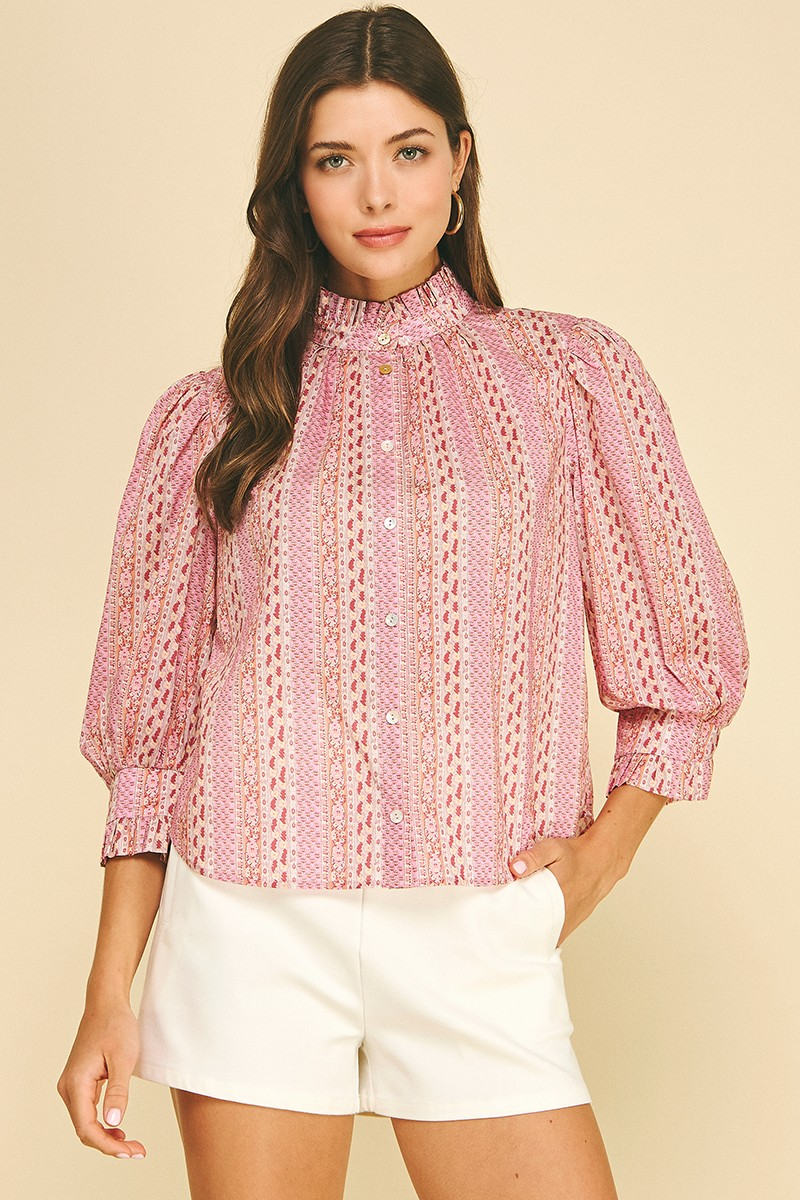 Woman wearing a pink Mabel Floral Botanical Print Button Down Blouse with white shorts.