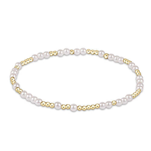 Hope Unwritten bracelet featuring a pearl bead alternating with gold-filled beads on elastic cord.
