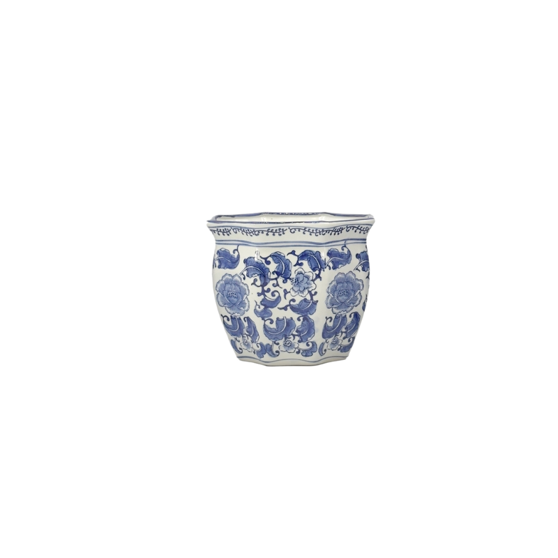 White ceramic chinoiserie planter pot with blue hand-painted floral patterns and fluted edges.