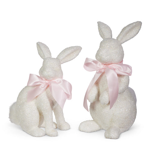 White glitter bunny figurine made of plastic foam with polyester fur measuring 6.5 by 9 inches.