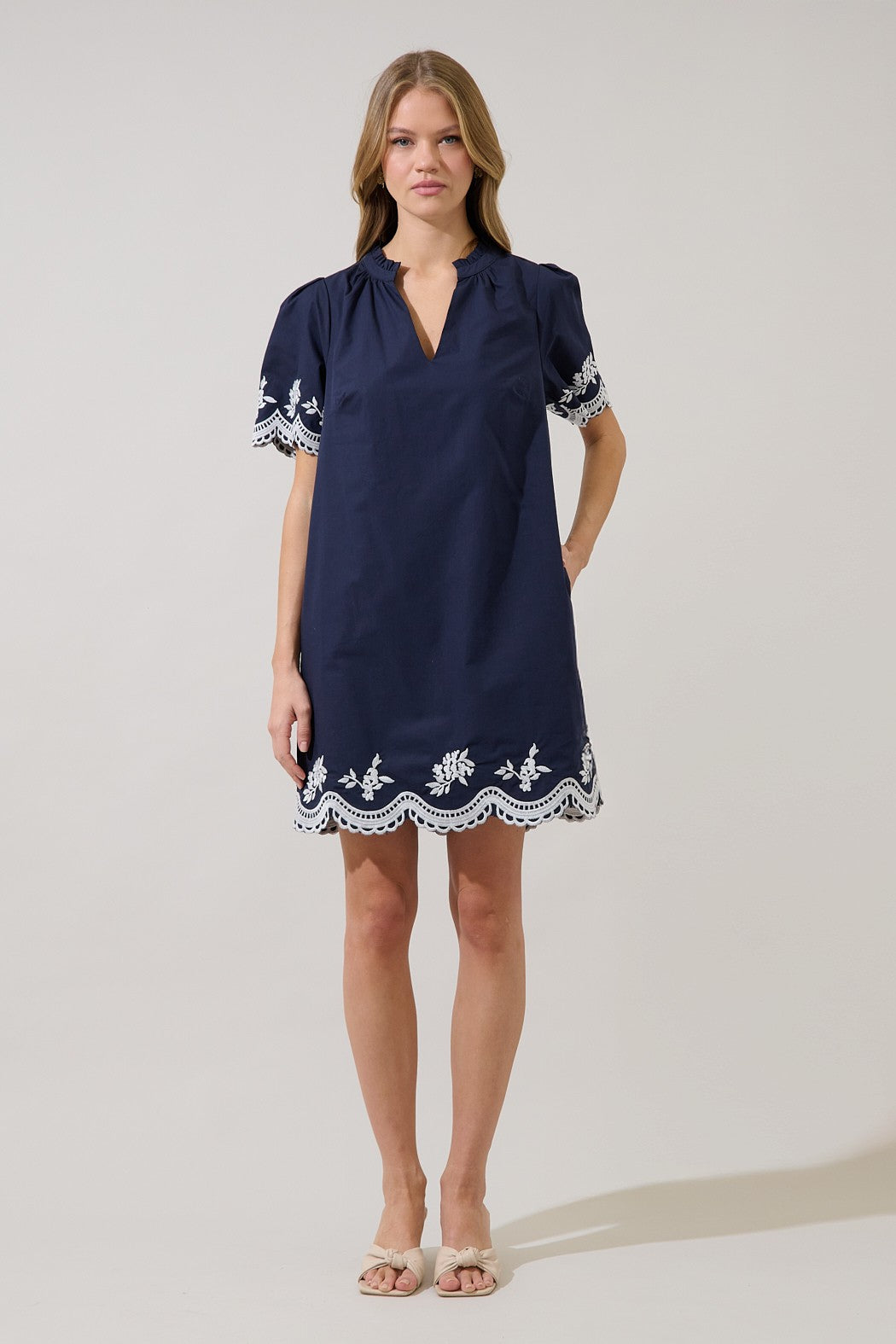 Melania embroidered shift mini dress in light beige with short sleeves.