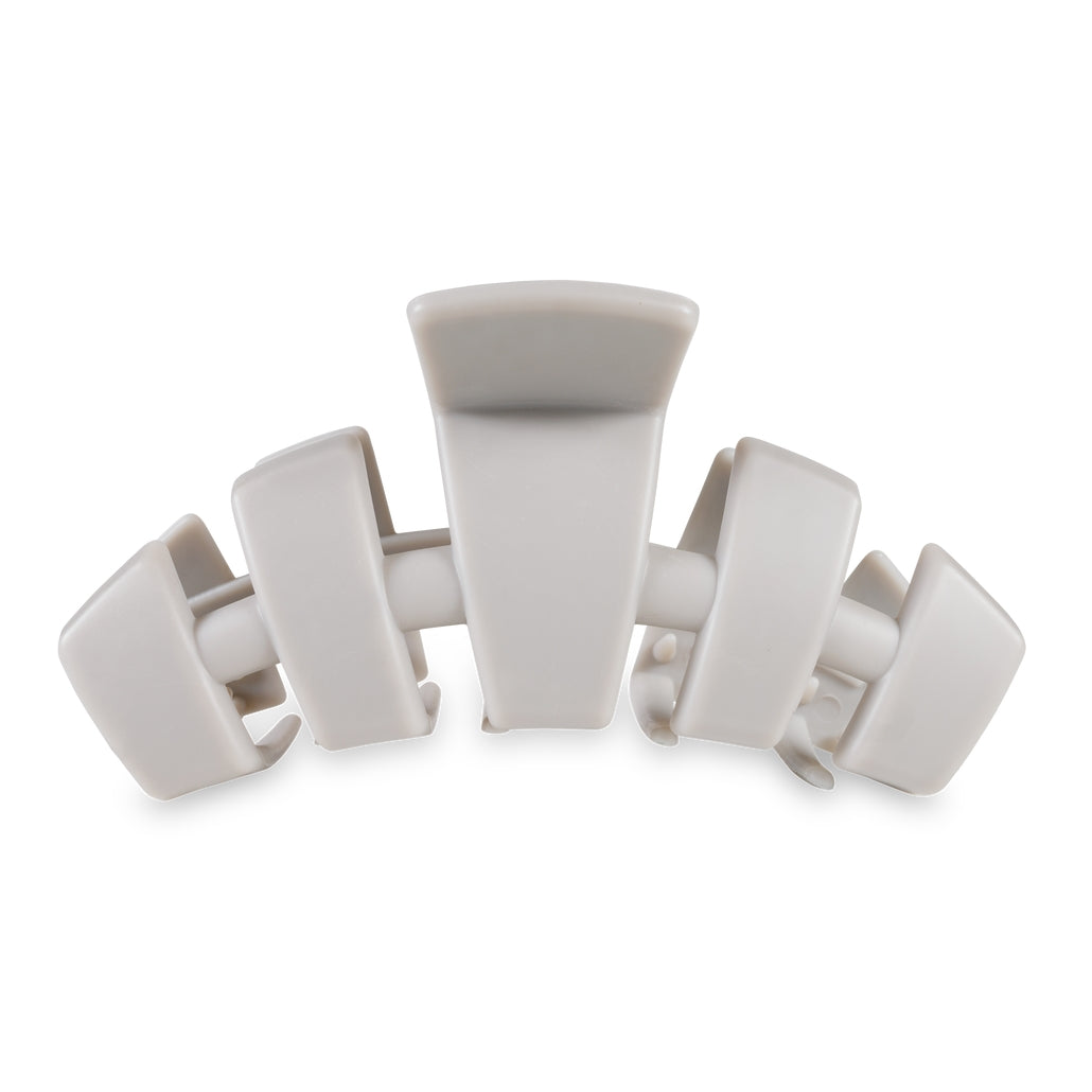 Large classic hair clip with bendable teeth in a neutral tone.