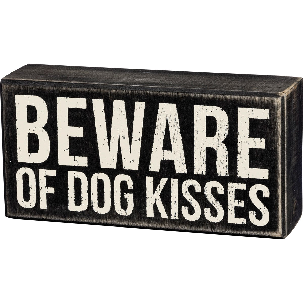 Black wooden box sign with distressed white text reading "BEWARE OF DOG KISSES".