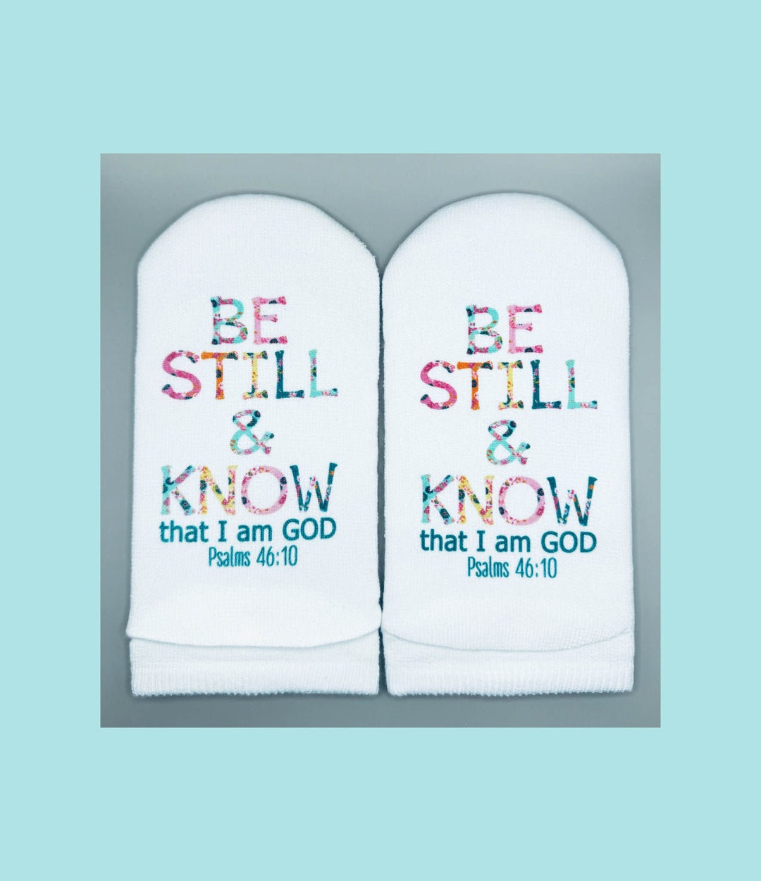 White women's no-show sock with floral letter print on top and Psalms verse text on the sole.