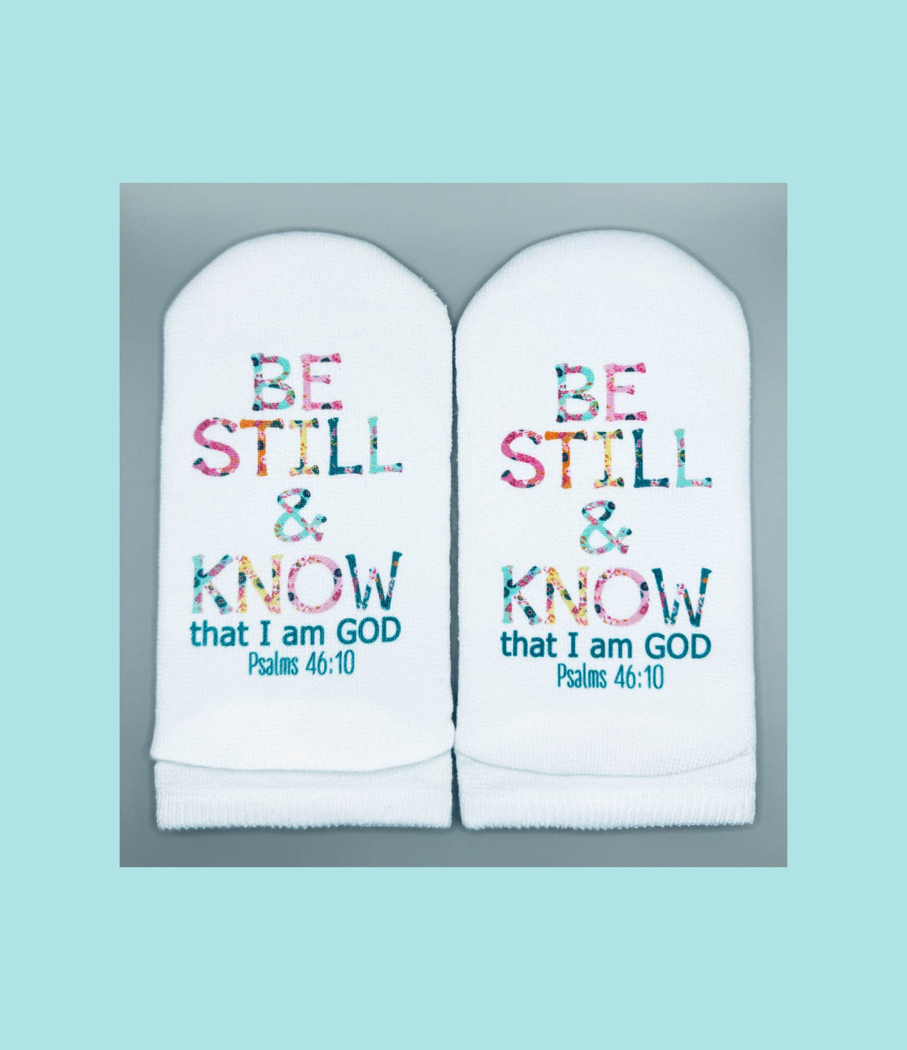 White women's no-show sock with floral letter print on top and Psalms verse text on the sole.